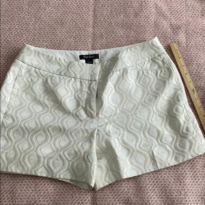 White with metallic pattern/detail.